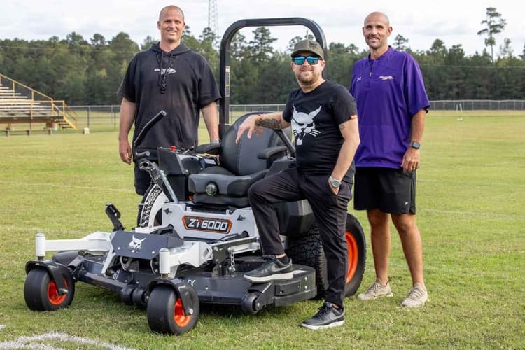 Justin Moore, Bobcat Donate Mower to Poyen High School